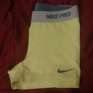 Bright neon Nike compression shorts